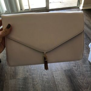White ASOS clutch with gold tassel